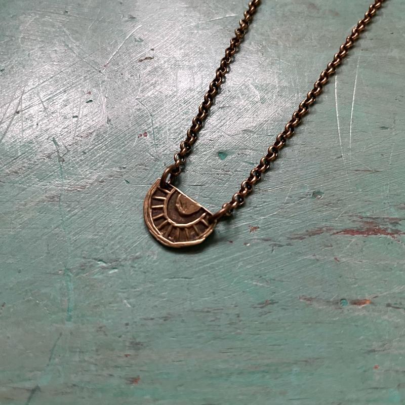 Tiny Brass "Sun-Bow" Necklace (upward facing, tight bow)