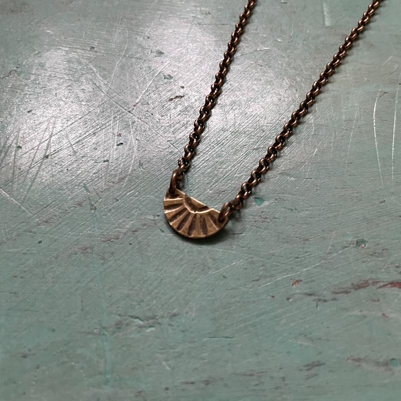 Tiny Brass Sunburst Necklace (upward facing)