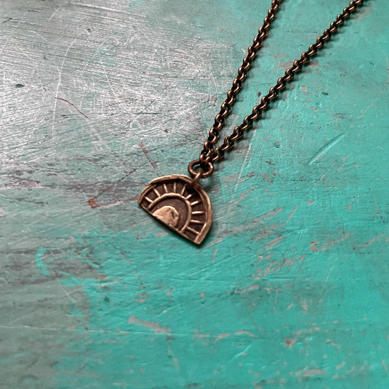 Tiny Brass "Sun-Bow" Necklace (downward facing, tight bow)