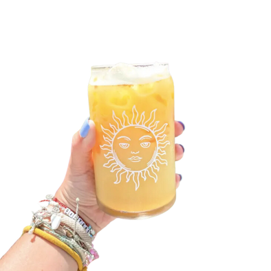 Glass cup with white sun illustration.  This 16 oz can glass cup is a great choice for hot and cold beverages. Its sun design is printed seamlessly around the glass with high-quality, durable ink for long-lasting durability. Plus, it is dishwasher safe and can last through more than 300 dishwasher cycles on the top rack.