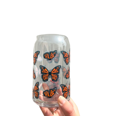Glass cup with monarch butterfly design. This 20oz can glass cup is a great choice for hot and cold beverages. Its butterfly design is printed seamlessly around the glass with high-quality, durable ink for long-lasting durability. Plus, it is dishwasher safe and can last through more than 300 dishwasher cycles on the top rack.