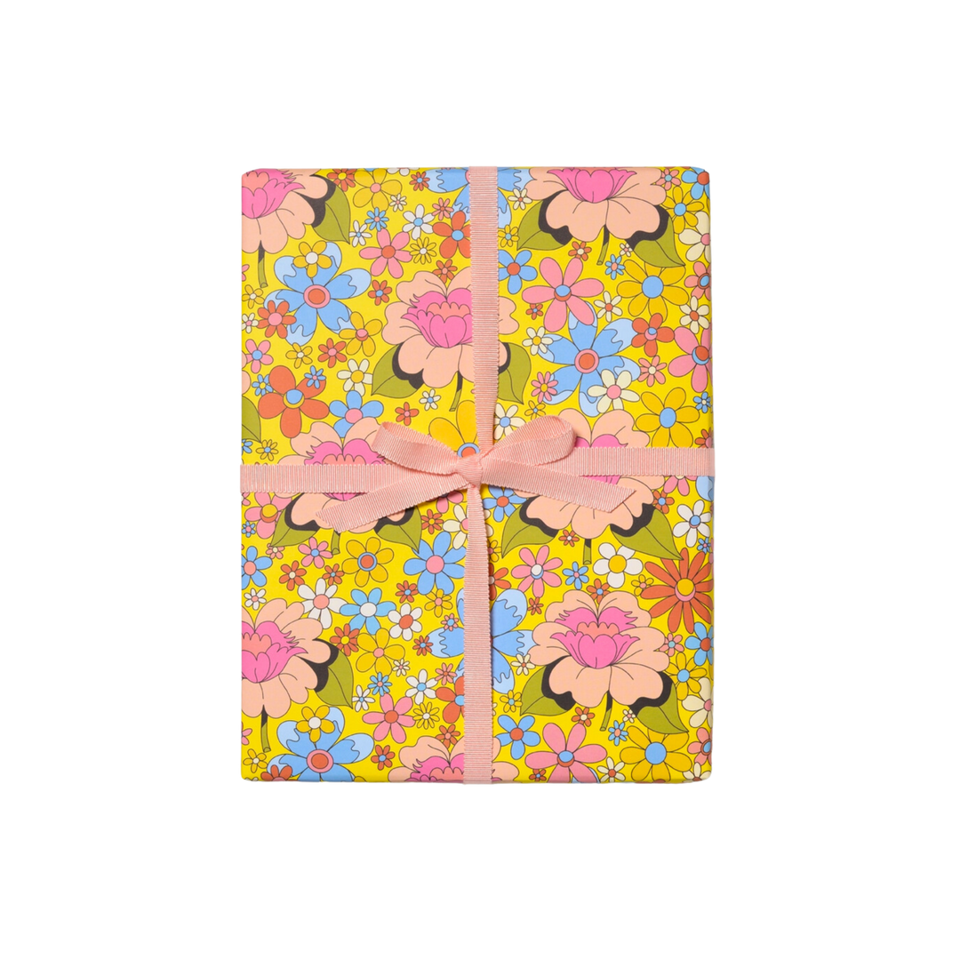 Colorful retro floral wrapping paper. Wrapped gift with Pink Bow