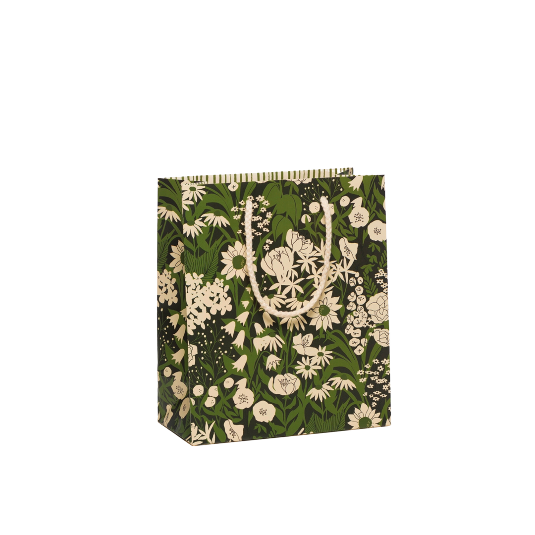 Green and white floral pattern on black background. Measuring 8 x 4 x 9.5 inches, this Heavyweight Coated Paper Bag features a Cotton Rope Handle and is illustrated by Dylan Mierzwinski.