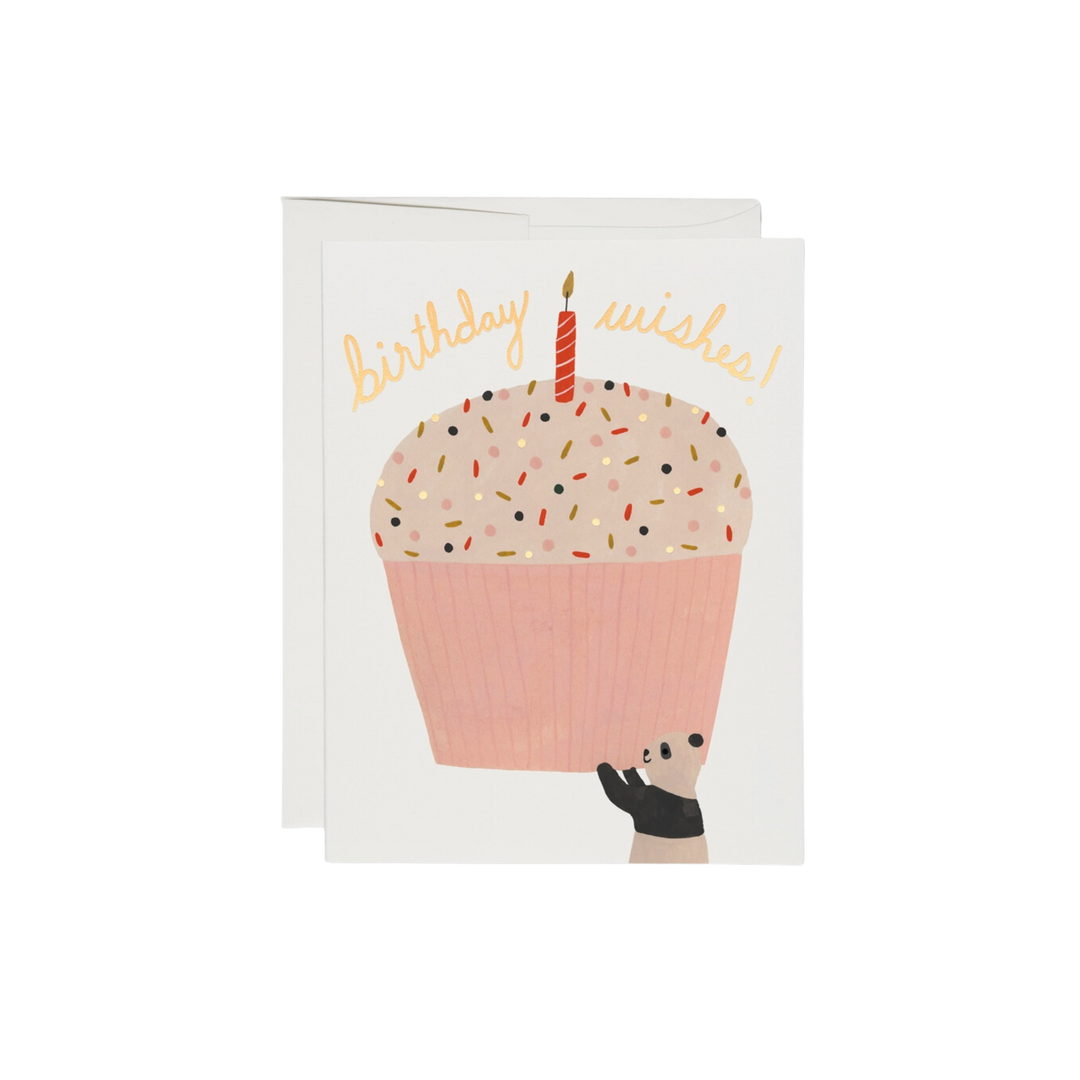Cartoon panda holding up cupcake with white background, yellow text says "Birthday Wishes". This 4.25 x 5.5-inch card is printed in USA on recycled paper. It features a foil stamped, offset printed design illustrated by Kate Pugsley, and is crafted with 100lb heavyweight card stock. Inside is blank.