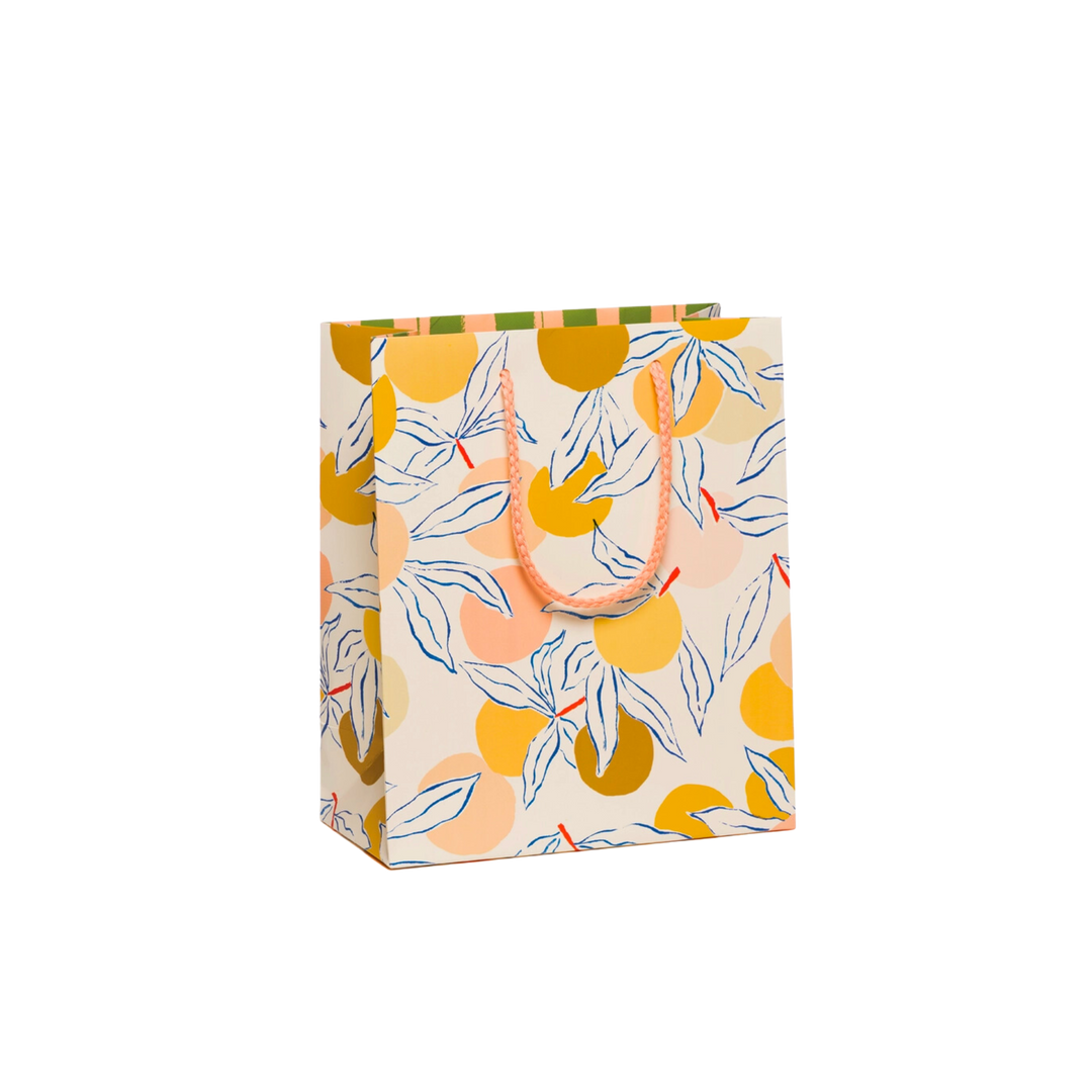 Illustrated peaches on white background with a peach colored handle. Measuring 8" x 4" x 9.5", this Small Gift Bag is constructed of Heavyweight Coated paper with a Cotton Rope Handle.