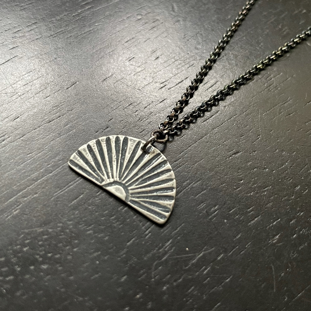 Silver Sunburst Necklace (Facing Downward)